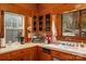 Kitchen corner with wood cabinets, white sink, and built-in appliances at 421 Wiley Ave, Salisbury, NC 28144