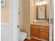 Powder room with granite vanity and wood cabinets at 4848 Kiser Island Dr, Terrell, NC 28682