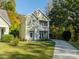 Two-story house with balcony, driveway, and landscaping at 4851 Eaves Ln, Charlotte, NC 28215