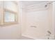 Simple bathroom with shower/tub and window at 608 Raintree Dr # 19A, Matthews, NC 28104