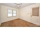 Cozy bedroom with a window and neutral wall colors at 608 Raintree Dr # 19A, Matthews, NC 28104