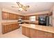 Kitchen features wood cabinets, an island, and appliances at 608 Raintree Dr # 19A, Matthews, NC 28104