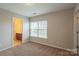 Spacious bedroom with window and access to bathroom at 7108 Kinley Commons Ln, Charlotte, NC 28278