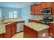 Updated kitchen with granite countertops and stainless steel appliances at 7108 Kinley Commons Ln, Charlotte, NC 28278