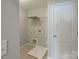 Laundry room with shelving and drain at 7108 Kinley Commons Ln, Charlotte, NC 28278