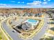 Aerial view of community pool, playground, and surrounding homes at 10352 Black Locust Ln, Charlotte, NC 28215