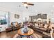 Open living room with kitchen view and leather seating at 10352 Black Locust Ln, Charlotte, NC 28215