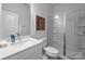 Modern bathroom with white vanity and glass shower at 13020 Moon Rd # 45, Charlotte, NC 28277