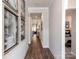 Bright hallway with hardwood floors and modern artwork at 131 Aberdeen Dr, Salisbury, NC 28144