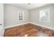 Bright bedroom with hardwood floors and large windows at 2515 Druid Hills Way, Charlotte, NC 28206