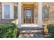 Elegant front door entry with brick columns and stone steps at 3003 Springs Farm Ln, Charlotte, NC 28226