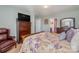 Spacious bedroom with a dresser, chair, and bed at 4024 Long Arrow Dr, Concord, NC 28025