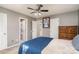 Spacious bedroom with a double bed, ceiling fan, and access to a full bathroom at 618 White Oak Ln, Matthews, NC 28104