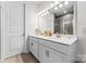 Modern bathroom with double vanity and a walk-in shower at 9232 Widden Way, Charlotte, NC 28269