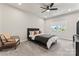 Cozy bedroom with a gray bed, carpet flooring, and a window with natural light at 9232 Widden Way, Charlotte, NC 28269