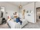 Bright bedroom with a queen bed, ensuite bathroom access, and ample natural light at 9232 Widden Way, Charlotte, NC 28269