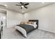 Spacious bedroom with a queen bed and ceiling fan at 9232 Widden Way, Charlotte, NC 28269