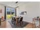 Modern dining room with a wooden table and a view to backyard at 9232 Widden Way, Charlotte, NC 28269