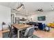 Open concept dining room with a wooden table and access to the backyard at 9232 Widden Way, Charlotte, NC 28269