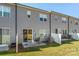 Townhouse exterior with gray siding and private patio at 9232 Widden Way, Charlotte, NC 28269