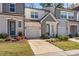 Two-story townhouses with attached garages and landscaped yards at 9232 Widden Way, Charlotte, NC 28269