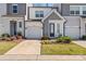 Attractive townhouses featuring attached garages and neatly landscaped front yards at 9232 Widden Way, Charlotte, NC 28269