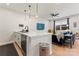 Modern kitchen with island, stainless steel appliances, and hardwood floors at 9232 Widden Way, Charlotte, NC 28269