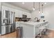Modern kitchen featuring stainless steel appliances and white cabinetry at 9232 Widden Way, Charlotte, NC 28269