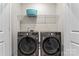 Laundry room with LG washer and dryer, and shelving at 9232 Widden Way, Charlotte, NC 28269