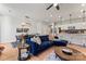 Spacious living room with a blue sectional sofa and plenty of natural light at 9232 Widden Way, Charlotte, NC 28269