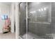 Clean shower with gray tile and glass enclosure at 9232 Widden Way, Charlotte, NC 28269