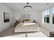 Spacious bedroom with a king-size bed and large window offering natural light at 13008 Moon Rd # 48, Charlotte, NC 28277