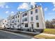 Row of townhouses with white siding and modern design at 13016 Moon Rd # 46, Charlotte, NC 28277