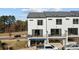 Rear view of townhome with private balcony and parking at 13016 Moon Rd # 46, Charlotte, NC 28277