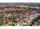 An expansive aerial view of a residential neighborhood during the autumn season at 139 Forest Walk Way, Mooresville, NC 28115