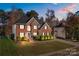 Brick two-story house with landscaping, a spacious yard, and a two-car garage at 139 Forest Walk Way, Mooresville, NC 28115