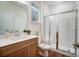 Modern bathroom with white subway tiles, glass shower, and wood vanity at 2015 Cedar Falls Dr # 72, Waxhaw, NC 28173