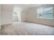 Bright bedroom with large window and view of neighborhood at 2015 Cedar Falls Dr # 72, Waxhaw, NC 28173