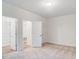 Bright bedroom with carpet flooring and access to closets and other rooms at 2015 Cedar Falls Dr # 72, Waxhaw, NC 28173