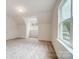 Well-lit bedroom featuring two windows and carpeted floors at 2015 Cedar Falls Dr # 72, Waxhaw, NC 28173