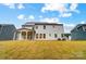Two-story home with white siding and covered porch at 2015 Cedar Falls Dr # 72, Waxhaw, NC 28173