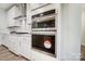 Stainless steel double oven built into white cabinets at 2015 Cedar Falls Dr # 72, Waxhaw, NC 28173