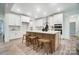 Modern kitchen with white cabinets, large island, and new appliances at 2015 Cedar Falls Dr # 72, Waxhaw, NC 28173