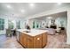 Bright kitchen with an island, hardwood floors, and views to the living room at 2015 Cedar Falls Dr # 72, Waxhaw, NC 28173