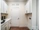 Bright laundry room with white cabinets and ample counter space at 2015 Cedar Falls Dr # 72, Waxhaw, NC 28173