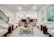 Open living room with view of kitchen and natural light at 2015 Cedar Falls Dr # 72, Waxhaw, NC 28173
