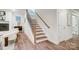 Elegant staircase with wood steps and metal railing at 2015 Cedar Falls Dr # 72, Waxhaw, NC 28173