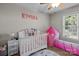 Adorable Bedroom with crib, play area, and plenty of natural light at 202 E 27Th E St, Kannapolis, NC 28083