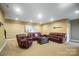 Spacious basement recreation room with leather furniture and a relaxing atmosphere at 226 Hermance Ln, Mooresville, NC 28117