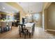 Bright dining room with table and chairs, kitchen view, and hardwood floors at 226 Hermance Ln, Mooresville, NC 28117